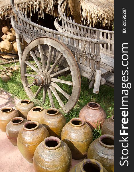 Many old earthen pots and buckboard in thai culture