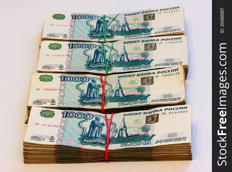 Cash, banknotes of one thousand russian rouble posted on the table. Cash, banknotes of one thousand russian rouble posted on the table