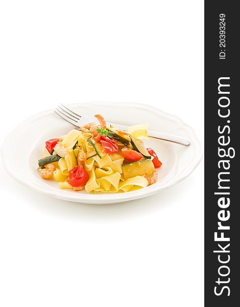 Photo of delicious pasta with zucchini and shrimps on white isolated background