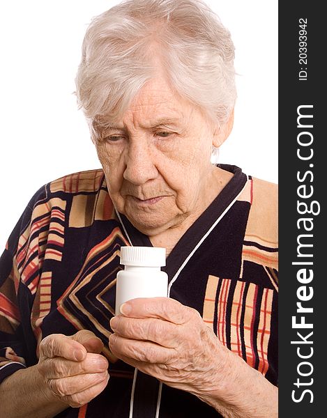 The elderly woman with tablets