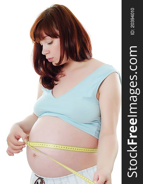 Pregnant Woman With A Measuring Tape