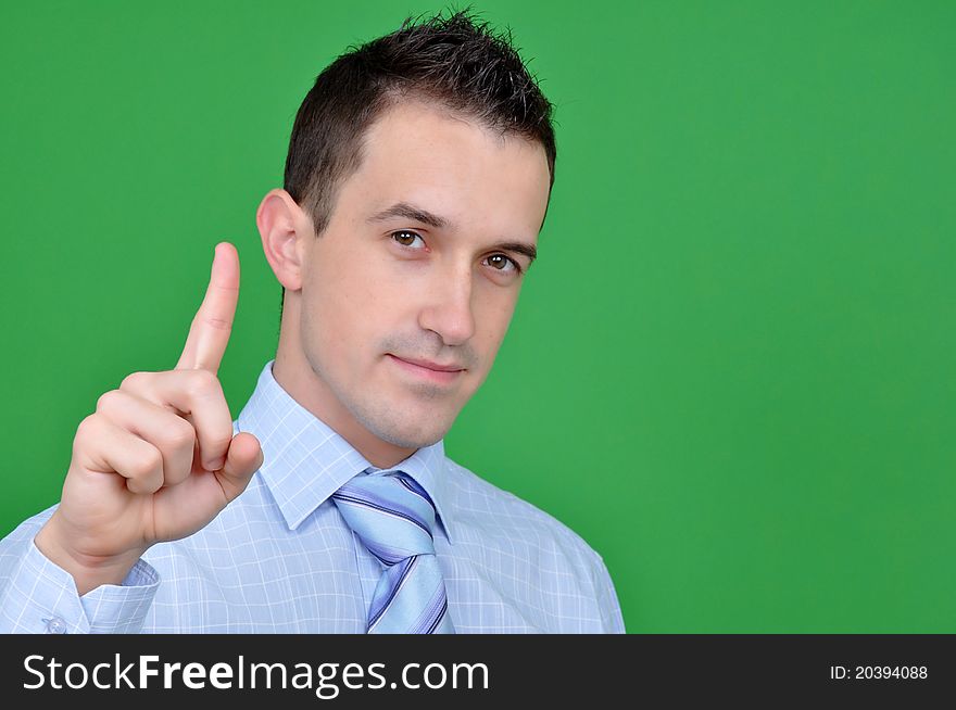 Young business man pointing with his finger