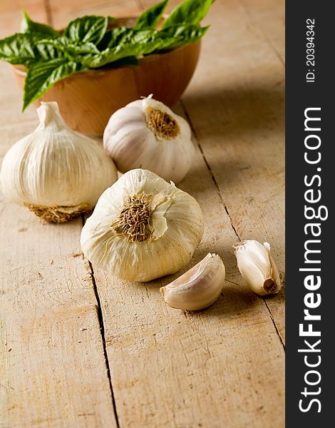 Photo of delicious fresh garlic on wooden table - Selective Focus