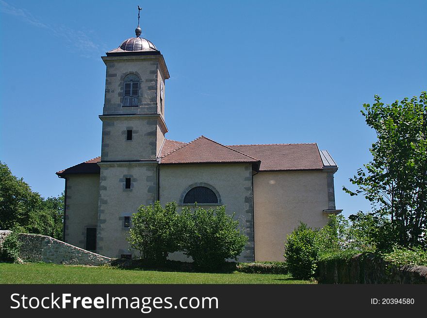 Clermont church in haute savoie against blue sky in french alps