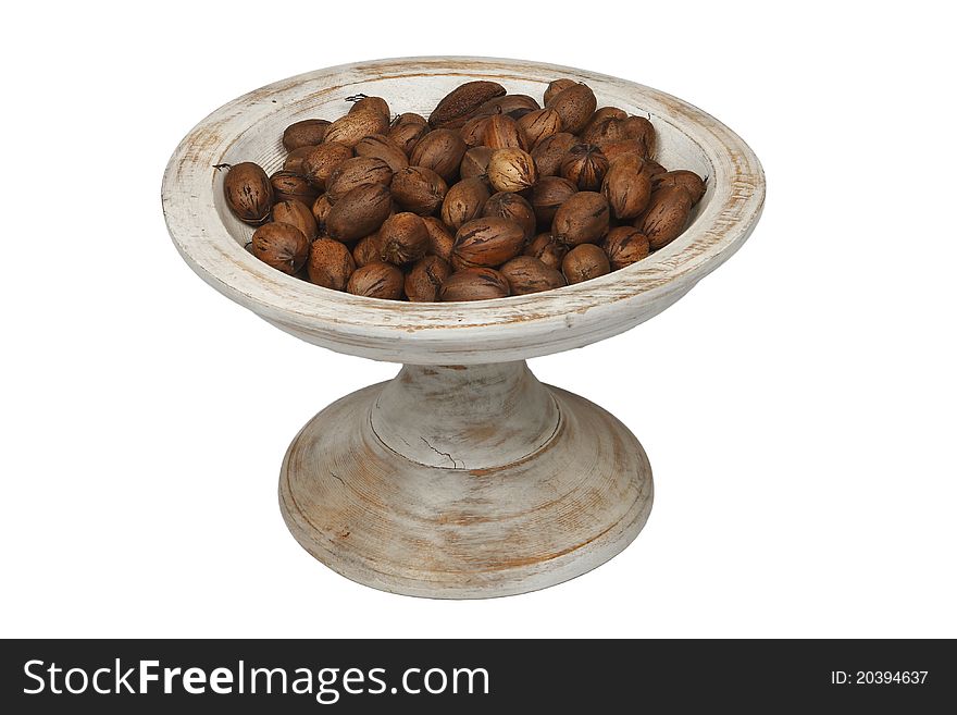 Bowl of chestnuts on white background