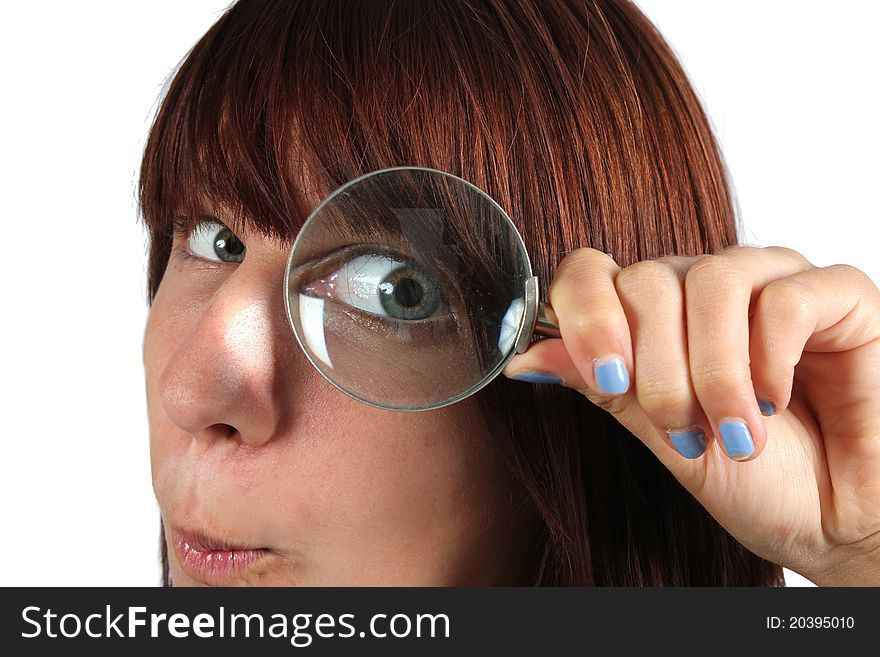 Girl searching for something with a magnifier. Girl searching for something with a magnifier