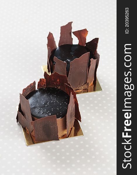 Double dark Chocolate cakes on gray background. Double dark Chocolate cakes on gray background