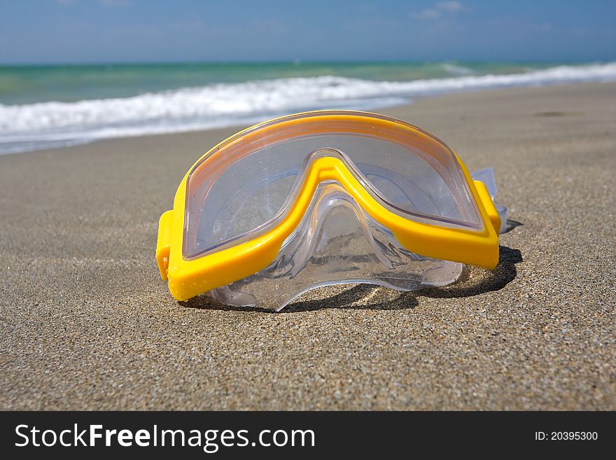 Swimming mask on sea beach