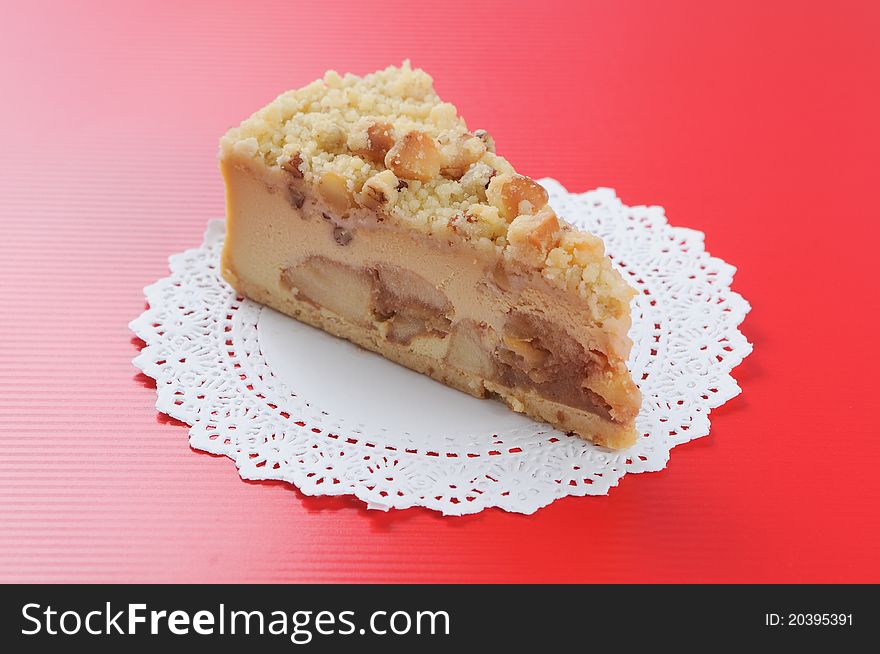 Macadamia Cheese Cake On Red Background