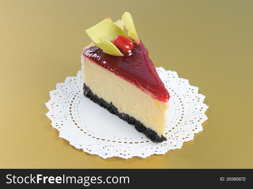 Cherry cheesecake with white round paper on yellow background. Cherry cheesecake with white round paper on yellow background.
