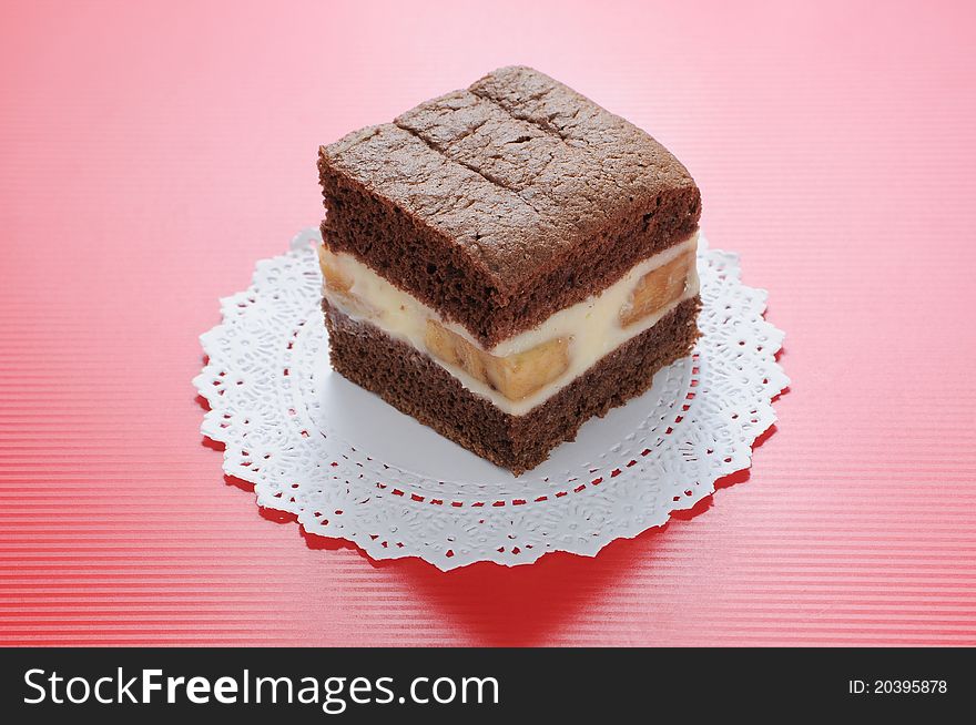 Chocolate Softcake With Banana On Red Background