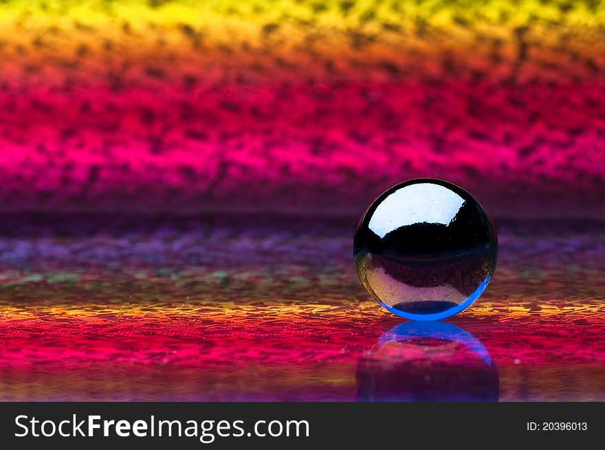 Crystal sphere on a colored background