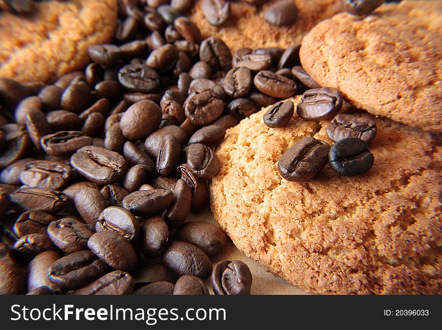 Coffee grains and cookies lay on a table