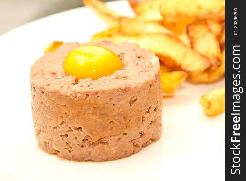 Beef tartare with egg yolk and french fries
