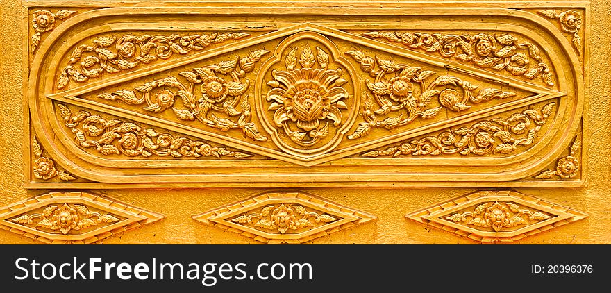 Golden Thai pattern desing on temple wall