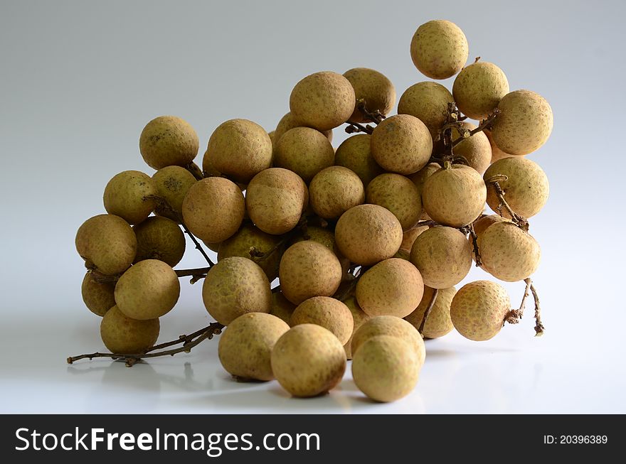 Longan - sweet fruit on a white background. Longan - sweet fruit on a white background.