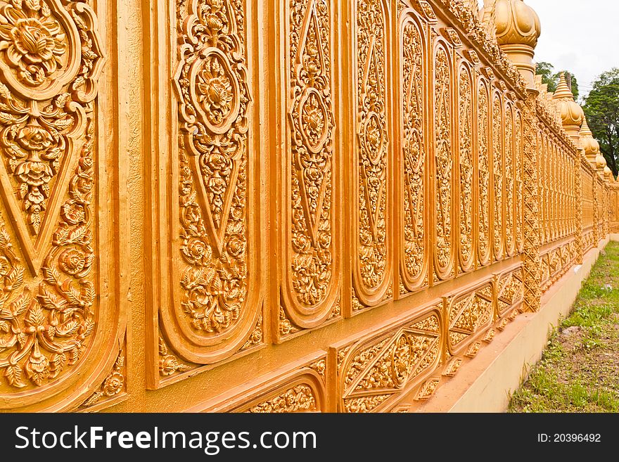 Golden Thai pattern desing on temple wall tilted out. Golden Thai pattern desing on temple wall tilted out