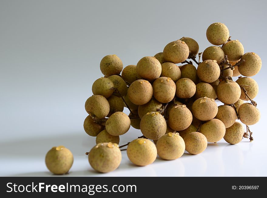 Longan - sweet fruit on a white background. Longan - sweet fruit on a white background.