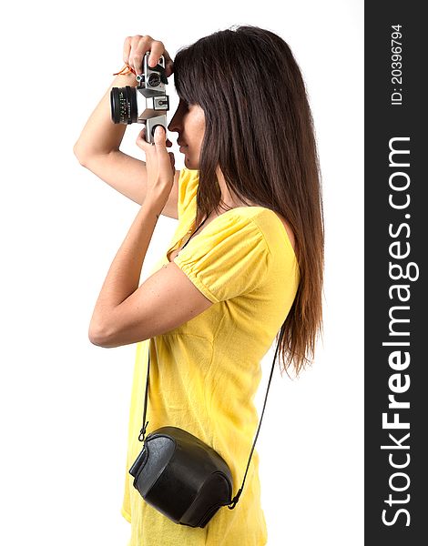 AN attractive brunette taking photographs with an old film camera. AN attractive brunette taking photographs with an old film camera