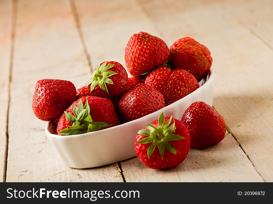 Photo of delicious red strawberries on wooden table