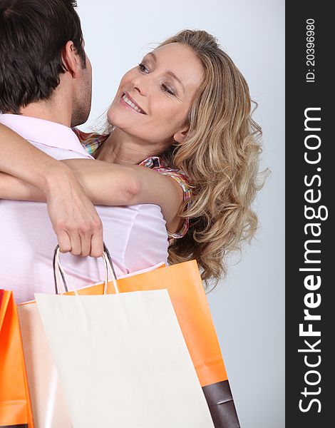 Woman  smiling with shopping bags. Woman  smiling with shopping bags