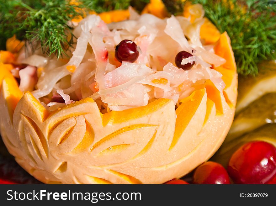 Sauerkraut with red cowberry in art pumpkin