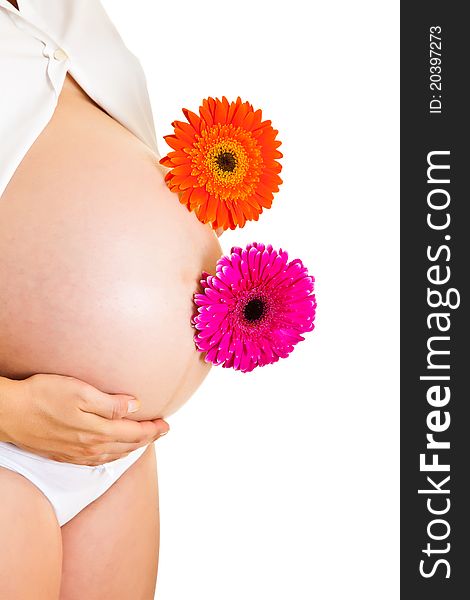 Pregnant woman holding gerbera flower isolated on white. Pregnant woman holding gerbera flower isolated on white