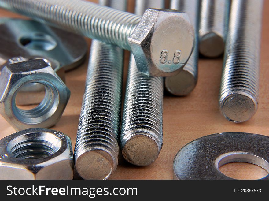 Metal brilliant nuts and bolts close up