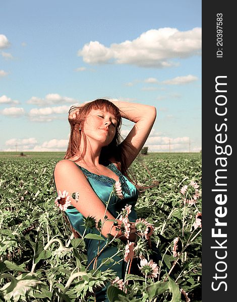 Girl standing on the sunflower field. Girl standing on the sunflower field