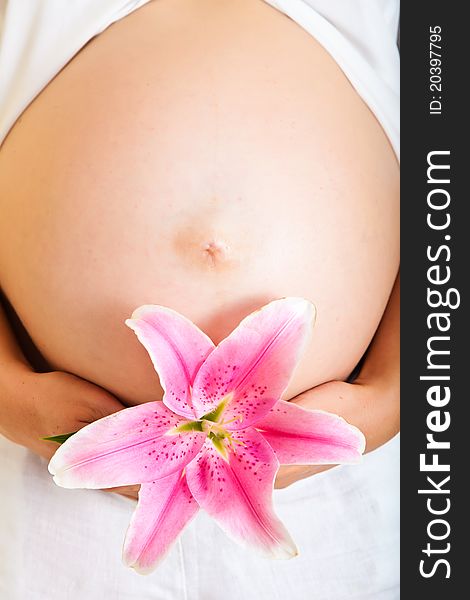 Pregnant Woman Holding Lillies