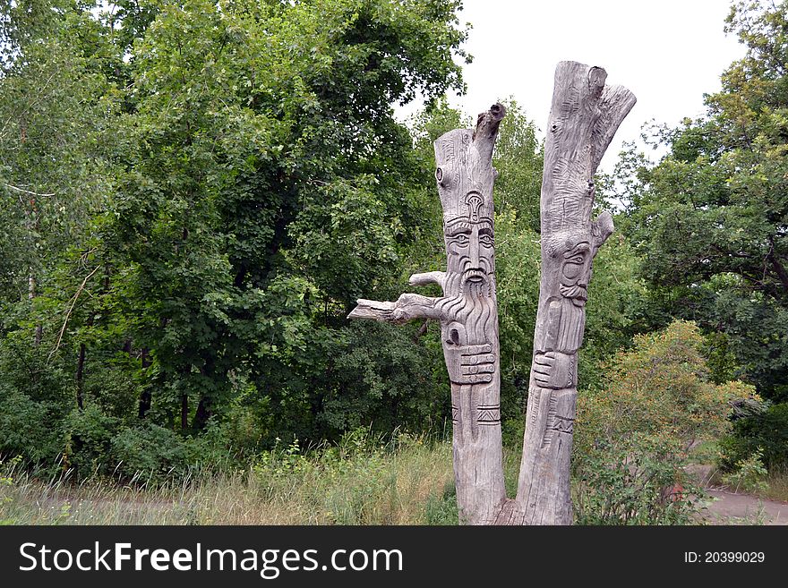 Figures of wooden people. Fantastic beings. A nature sanctuary