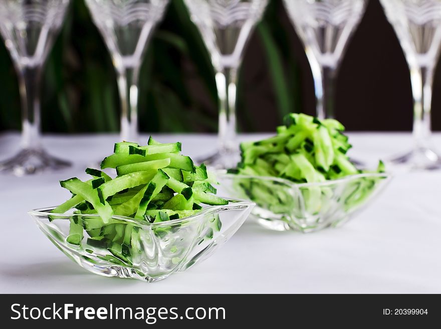 Fresh cucumber salad in the glass bowl