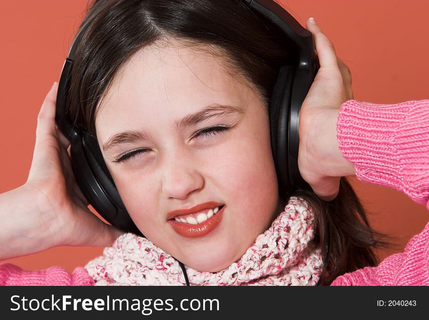 Pretty girl listening music in headphones