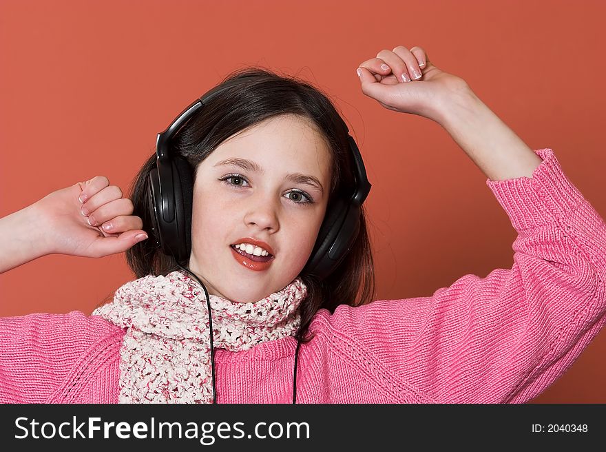 Pretty girl listening music in headphones