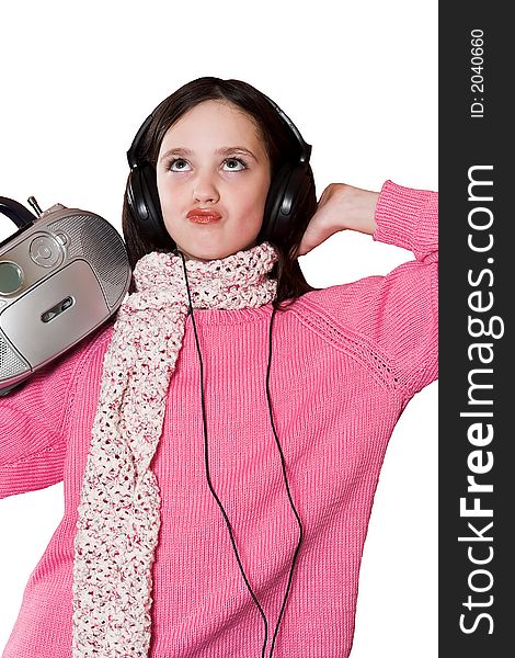 Pretty girl listening music with headphones and holding portable CD radio on white background