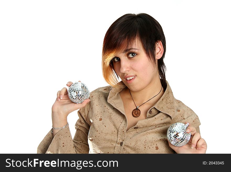 The young girl holds mirror spheres in hands