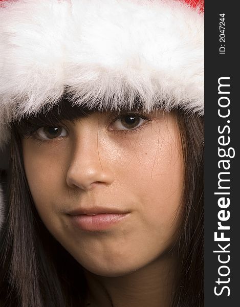 Cute young girl wearing a santa hat. Cute young girl wearing a santa hat