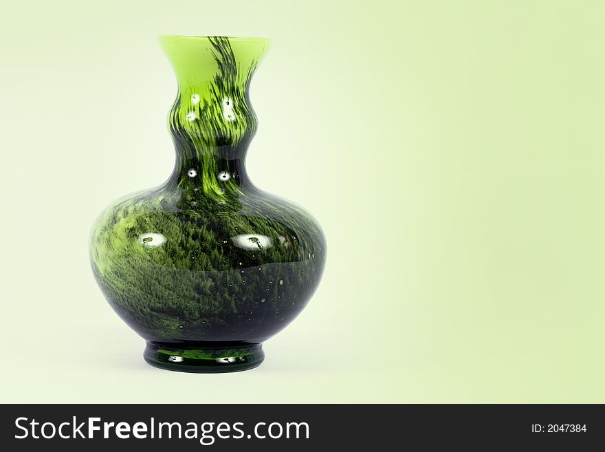 Pretty shades of green vase against pale green background