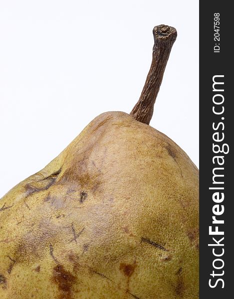 An over ripe pear on a white background symbolizing aging and decay. An over ripe pear on a white background symbolizing aging and decay