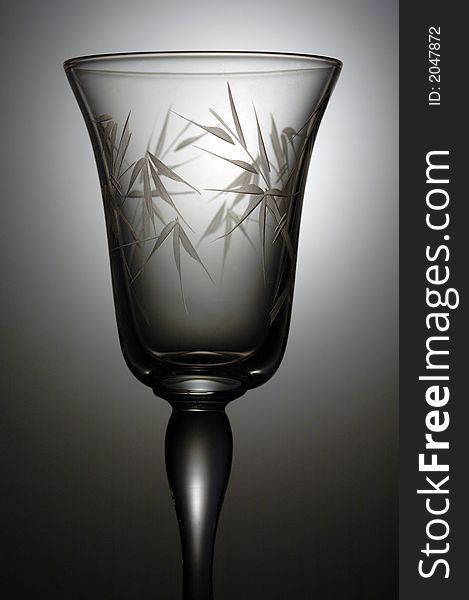 A very elegant cocktail glass. A low key image taken in a studio.