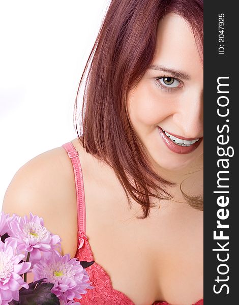 Smiling girl with flowers on white