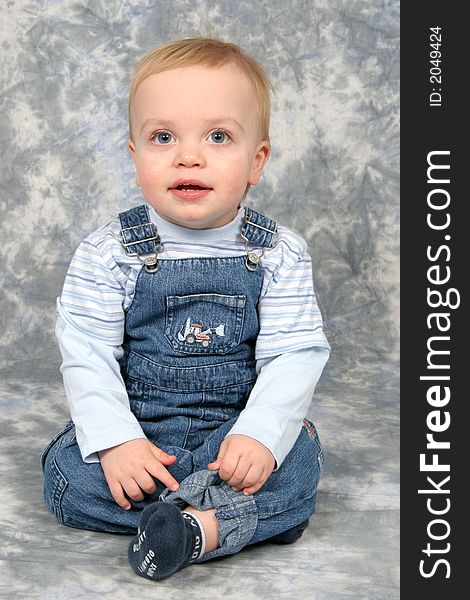 Little Boy Sitting in Studio