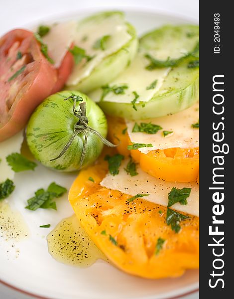 Heirloom Tomato Salad with shaved pecorino romano cheese and a drizzzle of olive oil salt and pepper. A healthy lunch, side dish, or appetizer,. Heirloom Tomato Salad with shaved pecorino romano cheese and a drizzzle of olive oil salt and pepper. A healthy lunch, side dish, or appetizer,