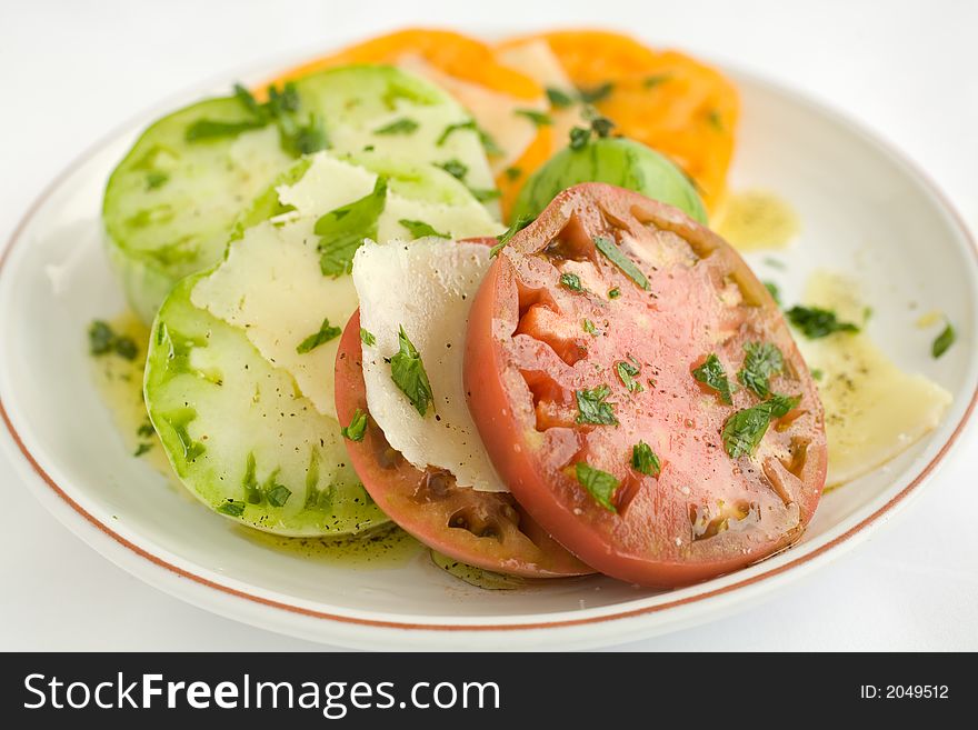 Heirloom Tomato Salad with shaved pecorino romano cheese and a drizzzle of olive oil salt and pepper. A healthy lunch, side dish, or appetizer,. Heirloom Tomato Salad with shaved pecorino romano cheese and a drizzzle of olive oil salt and pepper. A healthy lunch, side dish, or appetizer,