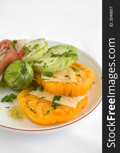 Heirloom Tomato Salad with shaved pecorino romano cheese and a drizzzle of olive oil salt and pepper. A healthy lunch, side dish, or appetizer,. Heirloom Tomato Salad with shaved pecorino romano cheese and a drizzzle of olive oil salt and pepper. A healthy lunch, side dish, or appetizer,