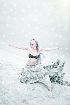 Beautiful Girl Enjoys Snowfall Royalty Free Stock Photos