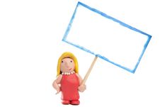 Blond Girl Made Of Clay Holding A Blank Sign Stock Image