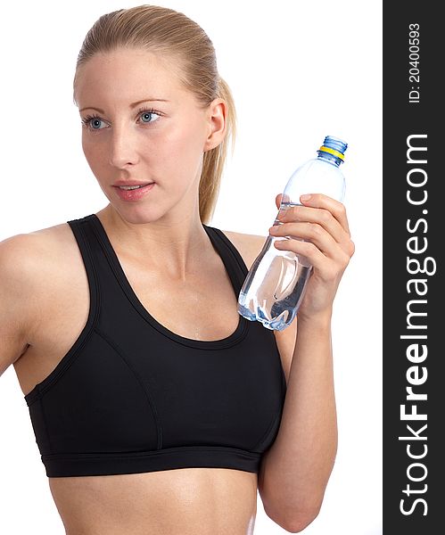 Closeup of young, fit, beautiful caucasian woman with black sport-bra drinking water. Closeup of young, fit, beautiful caucasian woman with black sport-bra drinking water