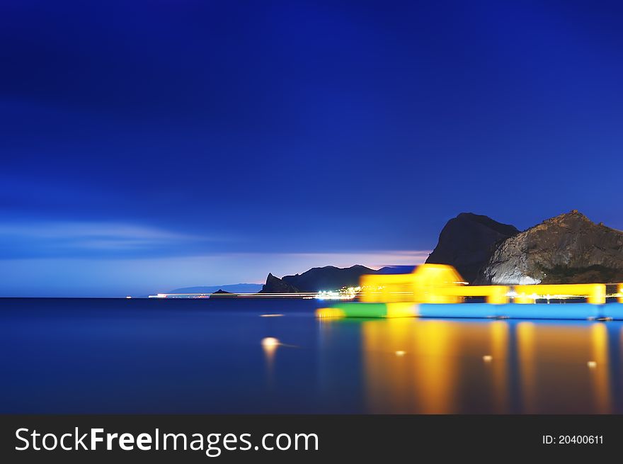 Night landscape with the sea and cape. A photo with long exposure. Night landscape with the sea and cape. A photo with long exposure