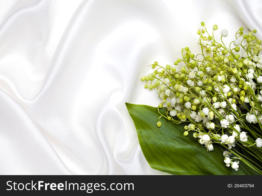 Lily Of The Valley And White Silk Background